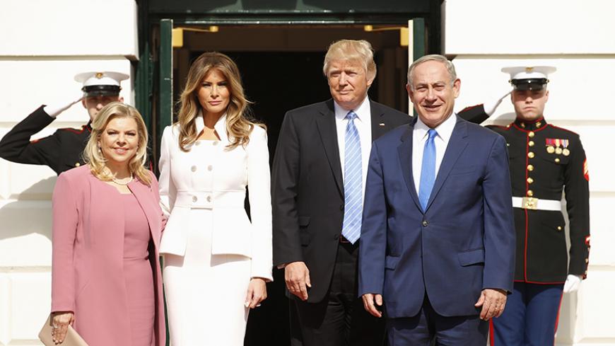 U.S. President Donald Trump (2ndR) and first lady Melania Trump greet Israeli Prime Minister Benjamin Netanyahu and his wife Sara (L) as they arrive at the South Portico of the White House in Washington, U.S., February 15, 2017. REUTERS/Kevin Lamarque  - RTSYTO4