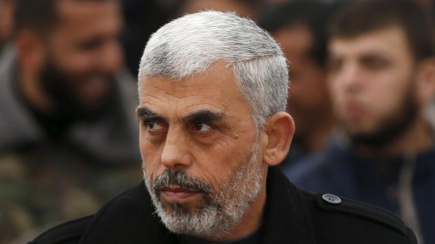 Hamas leader Yehia Sinwar attends a rally in Khan Younis in the southern Gaza Strip January 7, 2016. The rally, organized by Hamas movement, was held to honor the families of dead Hamas militants, who Hamas's armed wing said participated in imprisoning Israeli soldier Gilad Shalit, organizers said. Shalt was abducted by militants in a cross-border raid in 2006, and was released in exchange for more than 1,000 Palestinians held in Israeli jails. REUTERS/Mohammed Salem  - RTX21FPI