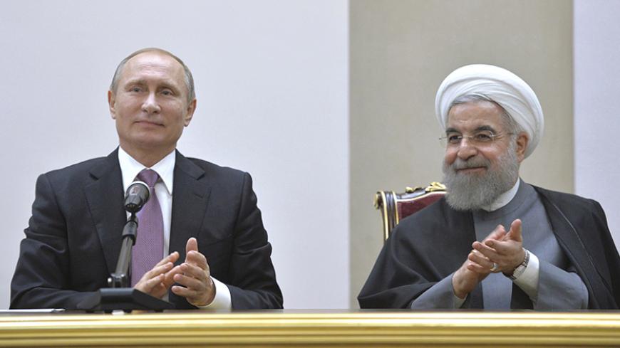 Russian President Vladimir Putin (L) and his Iranian counterpart Hassan Rouhani attend a news conference after the talks in Tehran, Iran, November 23, 2015. To match Insight RUSSIA-IRAN/  Alexei Druzhinin/Sputnik/Kremlin/File Photo via Reuters ATTENTION EDITORS - THIS IMAGE WAS PROVIDED BY A THIRD PARTY. EDITORIAL USE ONLY. - RTX2BOG5