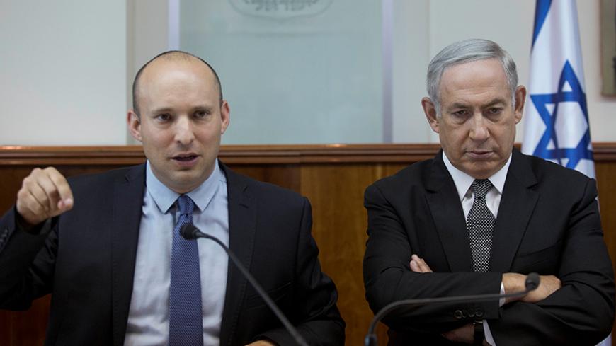 Israeli Prime Minister Benjamin Netanyahu (R) sits next to Education Minister Naftali Bennett during the weekly cabinet meeting at his office in Jerusalem, 30 August  2016. REUTERS/Abir Sultan/Pool - RTX2NKGO