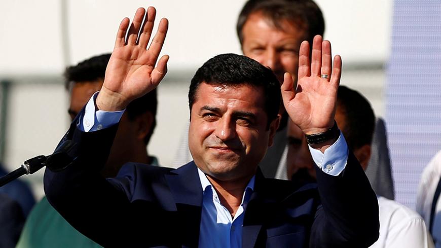 File Photo: Selahattin Demirtas, co-leader of the pro-Kurdish Peoples' Democratic Party (HDP), greets the crowd during a peace rally to protest against Turkish military operations in northern Syria, in Istanbul, Turkey, September 4, 2016. REUTERS/Osman Orsal/File Photo - RTX2RUA4