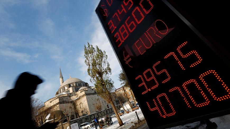 A board showing the currency exchange rates of the U.S. dollar and the Euro against Turkish lira is on display at a currency exchange office in Istanbul, Turkey, January 11, 2017. REUTERS/Murad Sezer - RTX2YFYP