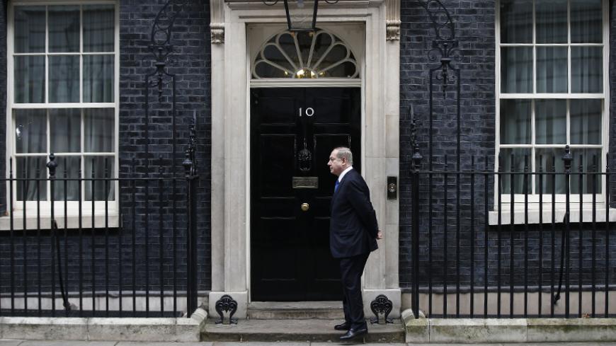 Israel's Prime Minister Benjamin Netanyahu stands alone on the doorstep of 10 Downing Street as he arrives to visit Britain's Prime Minister Theresa May in London, February 6, 2017.   REUTERS/Peter Nicholls  - RTX2ZTWJ