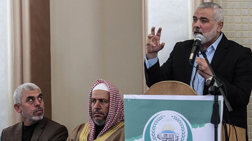 Yahya Sinwar (L) the new leader of Hamas in the Gaza Strip and senior political leaders of the Islamist movement Khalil al-Haya (C) Ismail Haniyeh (R) attend the opening of a new mosque in Rafah town in the southern Gaza Strip on February 24, 2017. / AFP / SAID KHATIB        (Photo credit should read SAID KHATIB/AFP/Getty Images)
