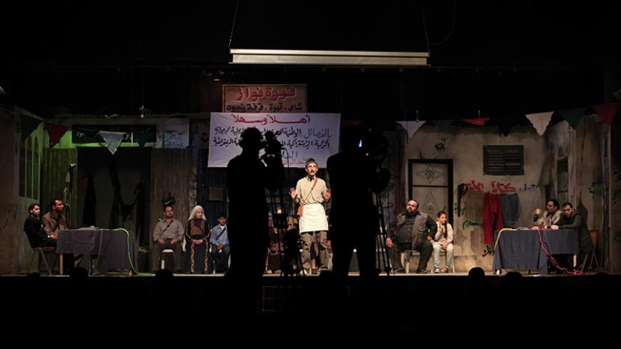 Palestinian artists perform at al-Shawa theatre in Gaza City March 9, 2010. Live theatre is rare in the Gaza Strip; public criticism of its Islamist rulers is rare too. So perhaps it was no surprise that a play which gives vent to Palestinians' frustrations with their leaders should be a hit. Picture taken March 9, 2010. To match Reuters Life! PALESTINIANS-GAZA/THEATRE   REUTERS/Suhaib Salem (GAZA - Tags: ENTERTAINMENT POLITICS SOCIETY) - RTR2BXPY