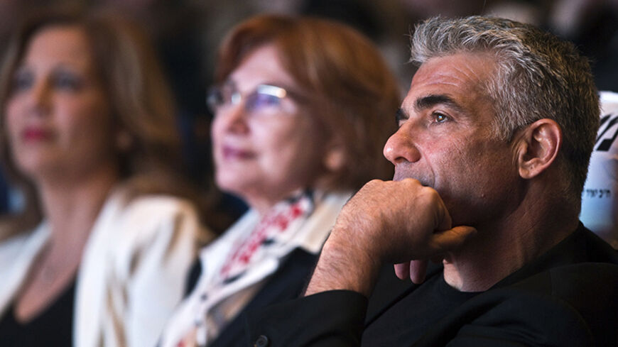 Yesh Atid leader Yair Lapid attends a women's committee convention in Tel Aviv March 1, 2015. The era of Prime Minister Benjamin Netanyahu is ending, with Israeli voters clearly more concerned about economic and social issues than about security or fears over Iran, a leading election candidate said on Monday. Lapid, a telegenic former news anchor and TV host, leads the centrist, secular Yesh Atid party ("There's a Future"), which emerged out of the cost-of-living protests that swept Israel in 2011. Picture 