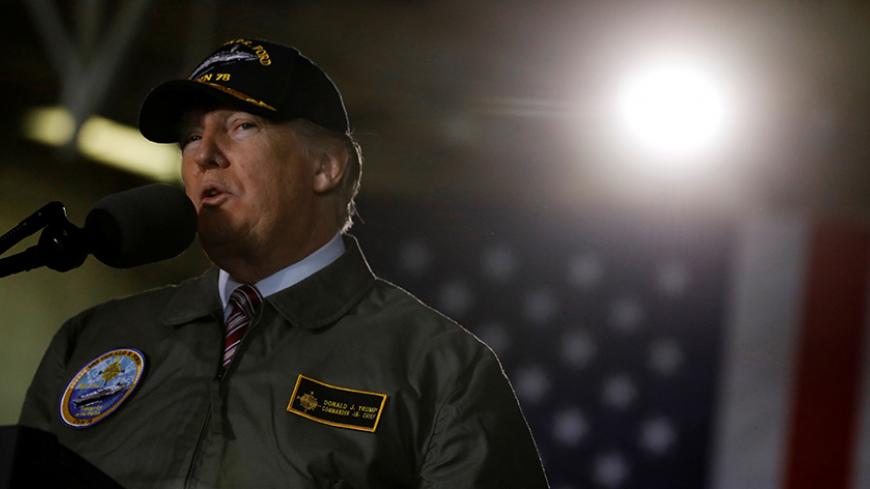 U.S. President Donald Trump delivers remarks aboard the pre-commissioned U.S. Navy aircraft carrier Gerald R. Ford at Huntington Ingalls Newport News Shipbuilding facilities in Newport News, Virginia, U.S. March 2, 2017. REUTERS/Jonathan Ernst - RTS1177C