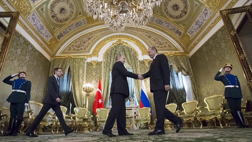 Russian President Vladimir Putin (L) shakes hands with his Turkish counterpart Tayyip Erdogan during a meeting at the Kremlin in Moscow, Russia, March 10, 2017. REUTERS/Zemlianichenko/Pool - RTS12A4O