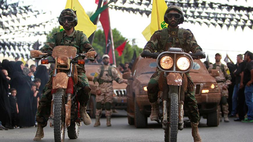 Hezbollah members on motorbikes and vehicles parade during a procession ahead of the day of Ashura, in the Saksakieh village, in southern Lebanon, October 9, 2016. REUTERS/Ali Hashisho - RTSRH2G