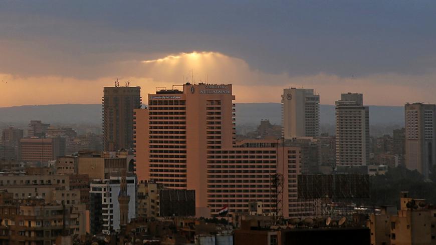 The sun sets over Hotel Intercontinental Semiramis during a cold weather around the country, in Cairo Egypt December 5, 2016. REUTERS/Amr Abdallah Dalsh - RTSUSW3