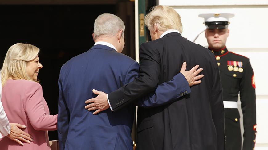 U.S. President Donald Trump (R) and first lady Melania Trump greet Israeli Prime Minister Benjamin Netanyahu and his wife Sara (2ndL) as they arrive at the South Portico of the White House in Washington, U.S., February 15, 2017. REUTERS/Kevin Lamarque  - RTSYTO0
