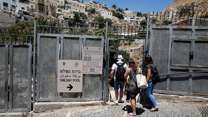 Visitors enter Shiloah Pool, part of an archaeological site known as a the City of David, still an active dig and also a tourist attraction, situated close to Silwan, a Palestinian neighbourhood next to Jerusalem's Old City June 30, 2016. REUTERS/Ammar Awad - RTX2J0X4