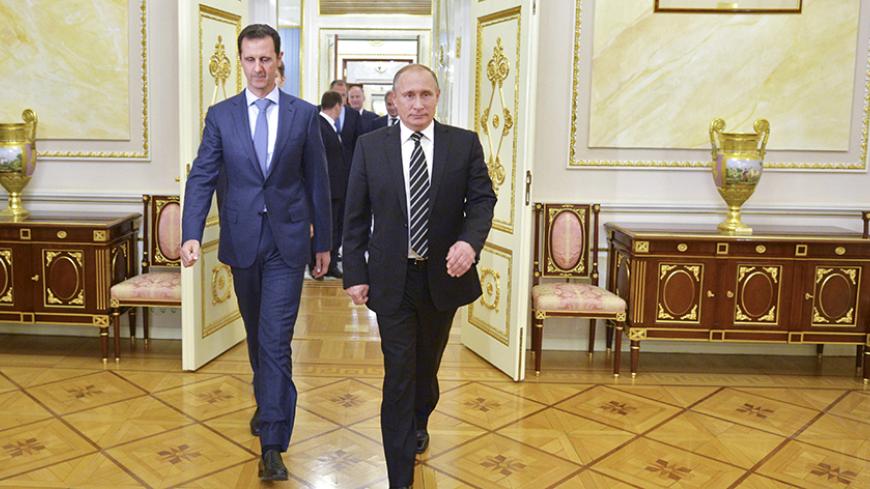 Russian President Vladimir Putin (R) and Syrian President Bashar al-Assad enter a hall during a meeting at the Kremlin in Moscow, Russia, October 20, 2015. Alexei Druzhinin/RIA Novosti/Kremlin/via REUTERS  ATTENTION EDITORS - THIS IMAGE HAS BEEN SUPPLIED BY A THIRD PARTY. IT IS DISTRIBUTED, EXACTLY AS RECEIVED BY REUTERS, AS A SERVICE TO CLIENTS EDITORIAL USE ONLY.  SEARCH "ALEPPO TIMELINE" FOR THIS STORY - RTX2UYYY