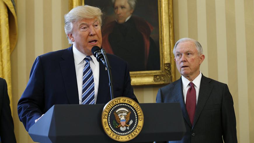 U.S. President Donald Trump speaks during a swearing-in ceremony for new Attorney General Jeff Sessions (R)  at the White House in Washington, U.S., February 9, 2017. REUTERS/Kevin Lamarque  - RTX30D9Z