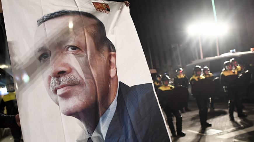 A large image of Turkish President Recep Tayyip Erdogan placed outside the Turkish consulate during protests in Rotterdam, Netherlands March 11, 2017.     REUTERS/YDylan Martinez - RTX30MGU