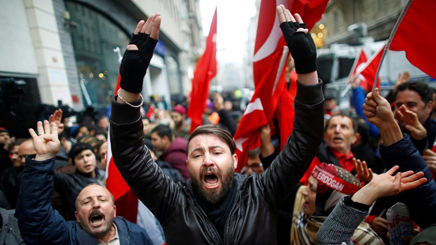 People shout slogans during a protest in front of the Dutch Consulate in Istanbul, Turkey, March 12, 2017. REUTERS/Osman Orsal - RTX30O56