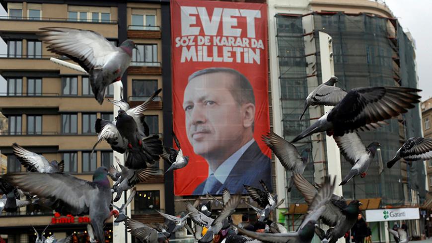 A campaign banner for the upcoming referendum with the picture of Turkish President Tayyip Erdogan is seen on Taksim square in central Istanbul, Turkey March 15, 2017. REUTERS/Murad Sezer - RTX314BZ