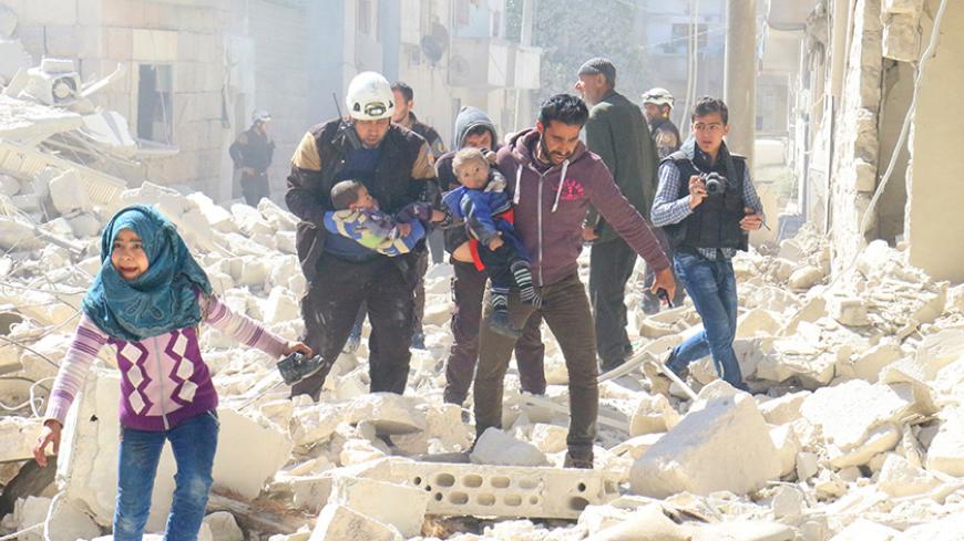 People and a civil defence personnel carry children at a damaged site after an air strike on rebel-held Idlib city, Syria March 19, 2017. REUTERS/Ammar Abdullah       TPX IMAGES OF THE DAY - RTX31PQN