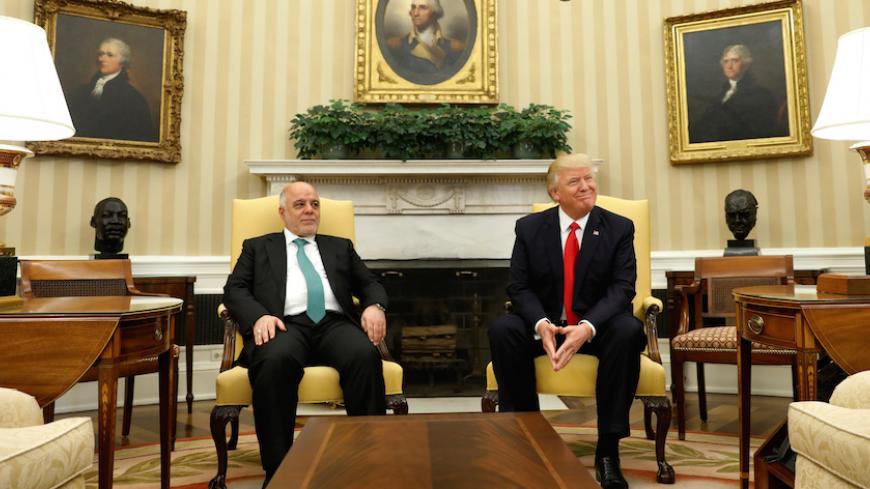 U.S. President Donald Trump meets with Iraqi Prime Minister Haider al-Abadi in the Oval Office at the White House in Washington, U.S., March 20, 2017. REUTERS/Kevin Lamarque - RTX31WQK