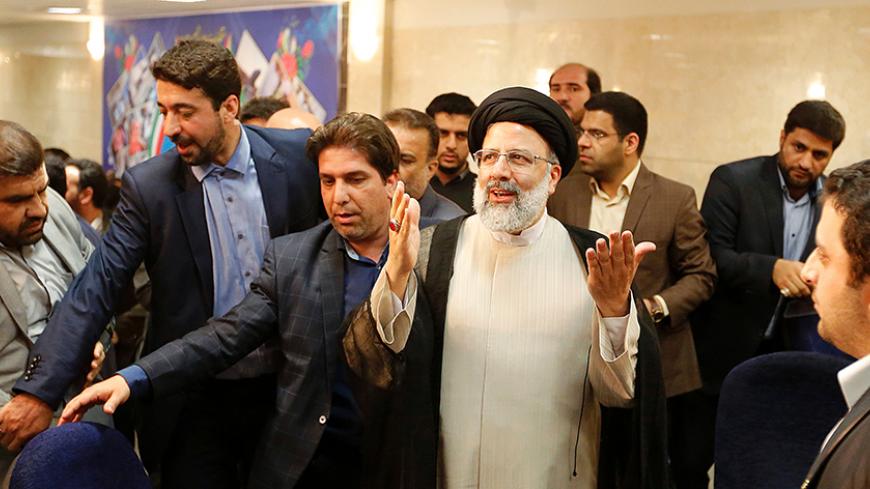Iranian cleric and head of the Imam Reza charitable foundation, Ebrahim Raisi, gestures while registering his candidacy for the upcoming presidential elections at the ministry of interior in the capital Tehran on April 14, 2017. / AFP PHOTO / ATTA KENARE        (Photo credit should read ATTA KENARE/AFP/Getty Images)