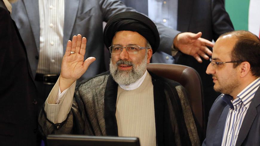 Iranian cleric and head of the Imam Reza charitable foundation, Ebrahim Raisi, gestures while registering his candidacy for the upcoming presidential elections at the ministry of interior in the capital Tehran on April 14, 2017. / AFP PHOTO / ATTA KENARE        (Photo credit should read ATTA KENARE/AFP/Getty Images)