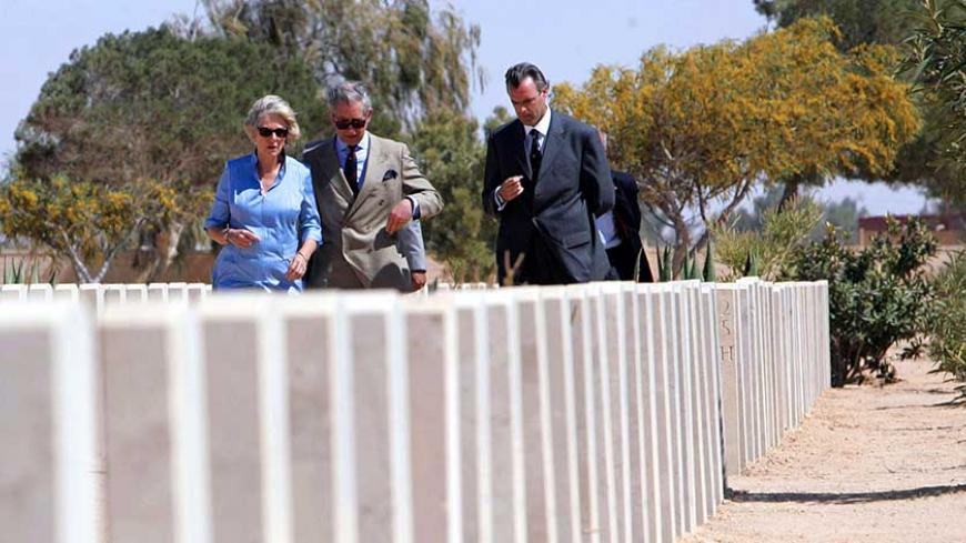 Britain's Prince Charles and his wife Camilla, the Duchess of Cornwall, visit the el-Alamein war cemetery, northwest of Egypt March 24, 2006. The royals visited the cemetery to honour Commonwealth servicemen who lost their lives during a pivotal battle of the Second World War.    REUTERS/Khaled Desouki/Pool - RTR17L27