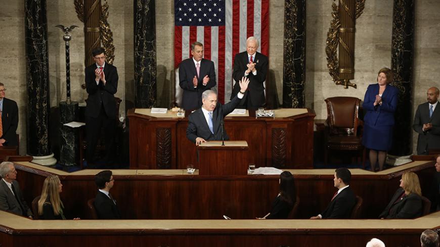 Israeli Prime Minister Benjamin Netanyahu (C) acknowledges applause at the end of his speech to a joint meeting of Congress in the House Chamber on Capitol Hill in Washington, March 3, 2015. REUTERS/Jonathan Ernst (UNITED STATES  - Tags: POLITICS)   - RTR4RX0Q