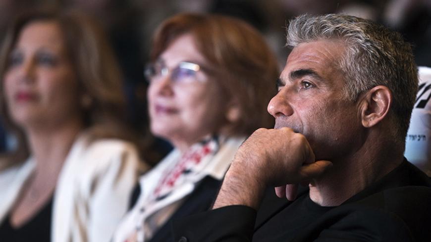 Yesh Atid leader Yair Lapid attends a women's committee convention in Tel Aviv March 1, 2015. The era of Prime Minister Benjamin Netanyahu is ending, with Israeli voters clearly more concerned about economic and social issues than about security or fears over Iran, a leading election candidate said on Monday. Lapid, a telegenic former news anchor and TV host, leads the centrist, secular Yesh Atid party ("There's a Future"), which emerged out of the cost-of-living protests that swept Israel in 2011. Picture 