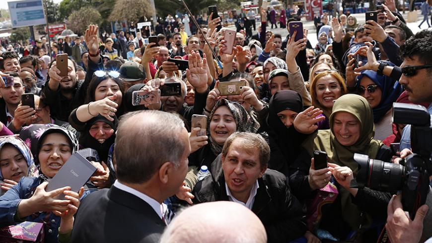 Turkish President Recep Tayyip Erdogan greets supporters as he leaves Eyup Sultan mosque in Istanbul, Turkey, April 17, 2017. REUTERS/Murad Sezer - RTS12LTA