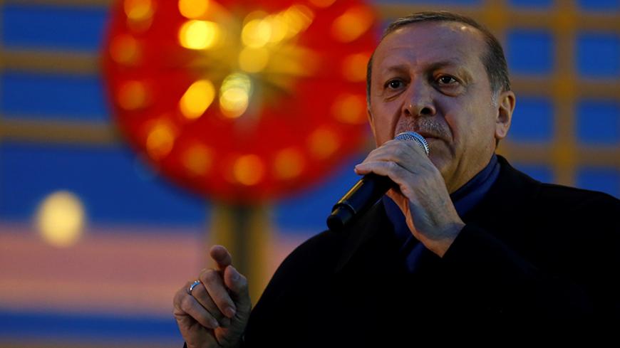 Turkish President Tayyip Erdogan addresses his supporters at the Presidential Palace in Ankara, Turkey, April 17, 2017. REUTERS/Umit Bektas - RTS12ODH