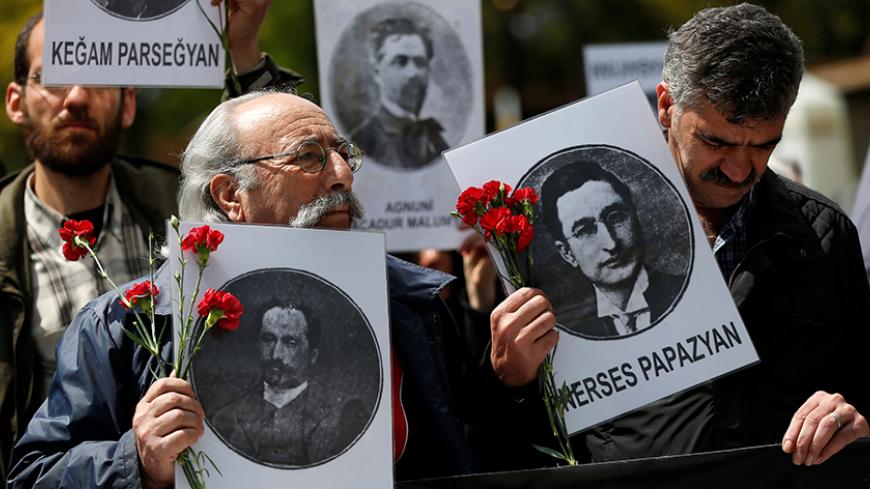 Human rights activists hold portraits of victims during a demonstration to commemorate the 1915 mass killing of Armenians in the Ottoman Empire, at Sultanahmet square in Istanbul, Turkey April 24, 2017. REUTERS/Murad Sezer - RTS13OEL