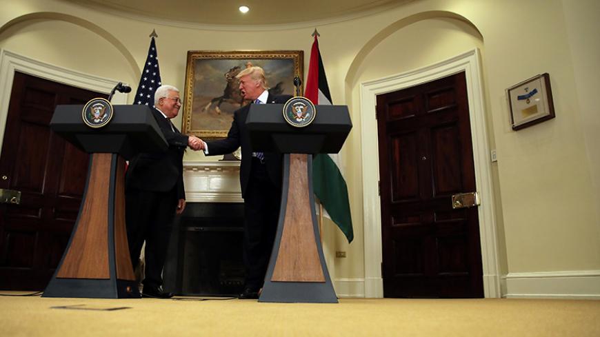 U.S. President Donald Trump shakes hands with Palestinian President Mahmoud Abbas as they deliver an statement at the White House in Washington D.C., U.S., May 3, 2017. REUTERS/Carlos Barria     TPX IMAGES OF THE DAY - RTS1502B