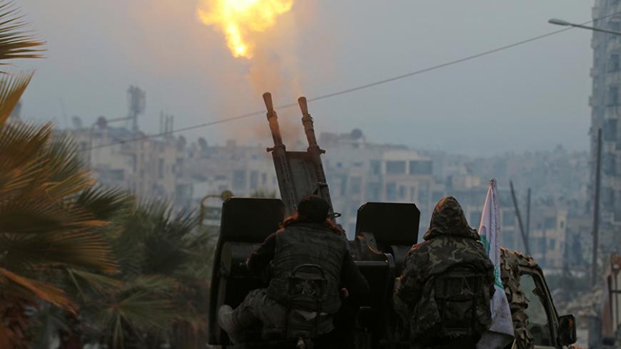 Free Syrian Army fighters fire an anti-aircraft weapon in a rebel-held area of Aleppo, Syria December 12, 2016. REUTERS/Abdalrhman Ismail - RTX2UP7M