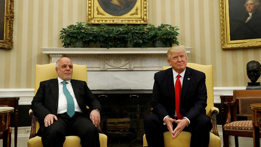 U.S. President Donald Trump meets with Iraqi Prime Minister Haider al-Abadi at the White House in Washington, U.S., March 20, 2017. REUTERS/Kevin Lamarque     TPX IMAGES OF THE DAY - RTX31WIV