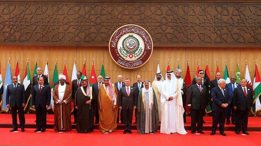 (front R-L) Yemen's President Abd-Rabbu Mansour Hadi, Palestinian President Mahmoud Abbas, Djibouti's President Ismail Omar Guelleh, Qatari Emir Sheikh Tamim bin Hamad al-Thani, Emir of Kuwait Sabah Al-Ahmad Al-Jaber Al-Sabah, Jordan's King Abdullah II, Saudi Arabia's King Salman bin Abdulaziz Al Saud, Bahrain's King Hamad bin Isa Al Khalifa, Sudan's President Omar Al Bashir, Egypt's President Abdel Fattah al-Sisi, and Mauritania's President Mohamed Ould Abdel Aziz pose for a group photograph during the 28t