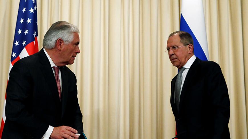 Russian Foreign Minister Sergei Lavrov and U.S. Secretary of State Rex Tillerson stand up to leave after a news conference following their talks in Moscow, Russia, April 12, 2017. REUTERS/Sergei Karpukhin - RTX35AP1