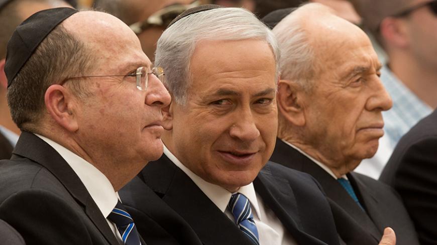 Israeli Prime Minister Benjamin Netanyahu (C), Israeli President Shimon Peres (R) and Israeli Defense Minister Moshe Ya'alon attend a ceremony for the laying of the foundation stone of the mount Herzl Memorial Hall for soldiers who have fallen in Israel's wars on April 30, 2014 in Jerusalem. Next week Israel will commemorate all Israel's fallen soldiers followed by celebrations for the anniversary of Israeli Independence Day on May 6 marking 66 years since the founding of the Jewish State in 1948 according 