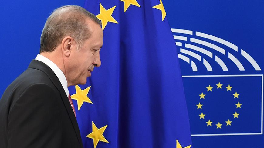 Turkey's President Recep Tayyip Erdogan looks on as he is welcomed by European Parliament President at the European Parliament in Brussels, on October 5, 2015, as part of a meeting with the European Union's top officials for urgent talks on the migration crisis and the Syrian war that is producing so many of the refugees. AFP PHOTO /EMMANUEL DUNAND        (Photo credit should read EMMANUEL DUNAND/AFP/Getty Images)