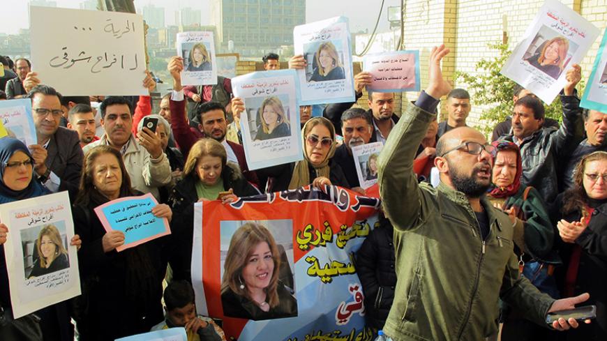 Protesters hold protraits of Iraqi female journalist Afrah Shawqi during a demonstration calling for her release on December 30, 2016, in Baghdad.
Shawqi, 43, who is employed by Asharq al-Awsat, a London-based pan-Arab newspaper, was abducted on December 26, 2016, from her home in a southern neighbourhood of the Iraqi capital. / AFP / SABAH ARAR        (Photo credit should read SABAH ARAR/AFP/Getty Images)