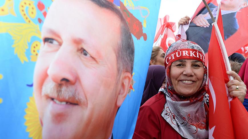 ANKARA, TURKEY - APRIL 17: Supporters of Turkish President Tayyip Erdogan wave national flags as they wait for his arrival at the Presidential Palace on April 17, 2017 in Ankara Turkey. Erdogan declared victory in Sunday's historic referendum that will grant sweeping powers to the presidency, hailing the result as a "historic decision. 51.4 per cent per cent of voters had sided with the "Yes" campaign, ushering in the most radical change to the country's political system in modern times.Turkey's main opposi