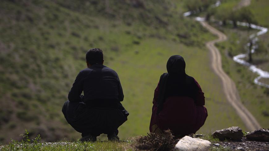 An Iranian Sunni Kurd couple is seen near Marivan in Kurdistan province, 512 km (320 miles) west of Tehran May 13, 2011. Iranian Shi'ite and Sunni Kurds live in harmony with each other in Marivan, although Sunni is the religion of the majority of the people. REUTERS/Morteza Nikoubazl (IRAN - Tags: SOCIETY RELIGION) - RTR2ME01
