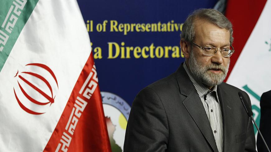 Iran's parliament speaker Ali Larijani speaks during a news conference in Baghdad December 24, 2014. REUTERS/Thaier Al-Sudani (IRAQ - Tags: POLITICS) - RTR4J5W0
