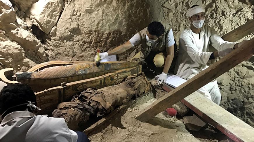 Egyptian antiquities workers are seen in a recently discovered tomb of Userhat, a judge from the New Kingdom at the Dra Abu-el Naga necropolis near the Nile city of Luxor, south of Cairo, Egypt April 18, 2017. REUTERS/ Mohamed Zaki - RTS12SLV