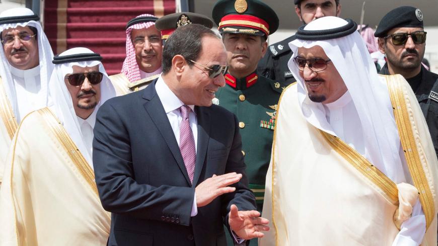Saudi Arabia's King Salman bin Abdulaziz Al Saud (R) stands with Egypt's President Abdel Fattah al-Sisi during a welcoming ceremony in Riyadh, Saudi Arabia, April 23, 2017. Bandar Algaloud/Courtesy of Saudi Royal Court/Handout via REUTERS ATTENTION EDITORS - THIS PICTURE WAS PROVIDED BY A THIRD PARTY. FOR EDITORIAL USE ONLY. - RTS13IR3