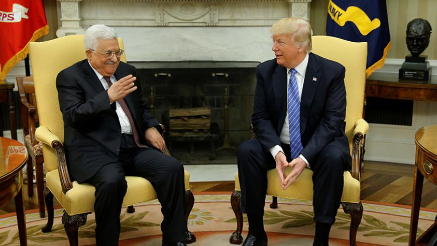 U.S. President Donald Trump (R) welcomes Palestinian Authority President Mahmoud Abbas in the Oval Office at the White House in Washington, U.S. May 3, 2017.  REUTERS/Jonathan Ernst - RTS14ZK3