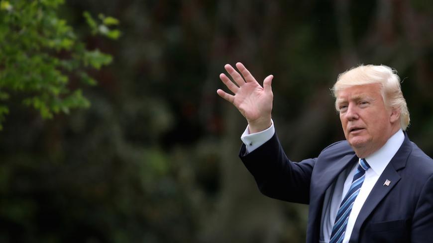 U.S. President Donald Trump waves as he leaves the Oval Office of the White House in Washington, U.S., before his departure to New York May 4, 2017. REUTERS/Carlos Barria - RTS1581R