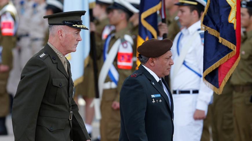 General Joseph Dunford (L), the Chairman of the U.S. Joint Chiefs of Staff, walks next to Israel's Chief of Staff Lieutenant-General Gadi Eizenkot, as they review an honour guard in Tel Aviv, Israel May 9, 2017. REUTERS/Nir Elias - RTS15RRC