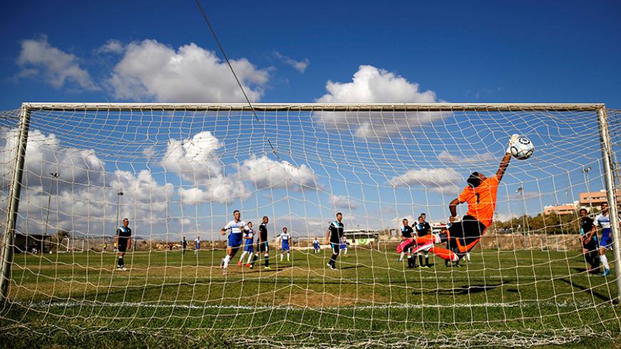 Players from Israeli soccer clubs affiliated with Israel Football Association, Ariel Municipal Soccer Club and Maccabi HaSharon Netanya, play against each other at Ariel Municipal Soccer Club's training grounds in the West Bank Jewish settlement of Ariel September 23, 2016. Picture taken September 23, 2016. REUTERS/Amir Cohen  - RTSPDUE