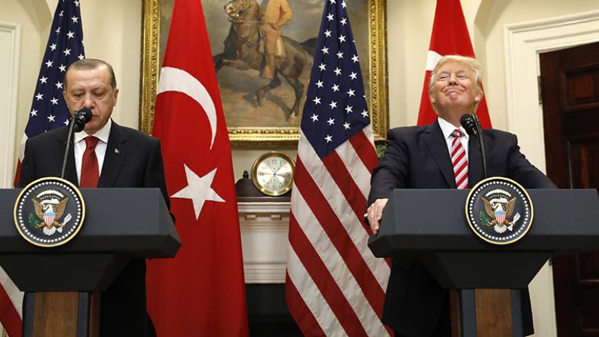 Turkey's President Recep Tayyip Erdogan (L) and U.S President Donald Trump deliver statements to reporters in the Roosevelt Room of the White House in Washington, U.S. May 16, 2017. REUTERS/Kevin Lamarque - RTX363IZ