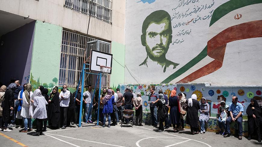 Voters stand in a queue to cast their ballots during the presidential election in a Jewish and Christian district in the center of Tehran, Iran, May 19, 2017. TIMA via REUTERS ATTENTION EDITORS - THIS IMAGE WAS PROVIDED BY A THIRD PARTY. FOR EDITORIAL USE ONLY. - RTX36KPS
